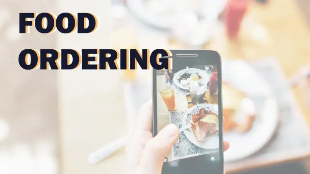 Food Ordering — a phone photographing a plate of breakfast food on a table