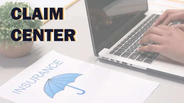Claim Center — hands typing on a laptop beside an insurance document with an umbrella logo