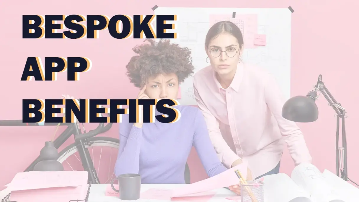 Title card reading Bespoke App Benefits over two colleagues reviewing plans at a desk