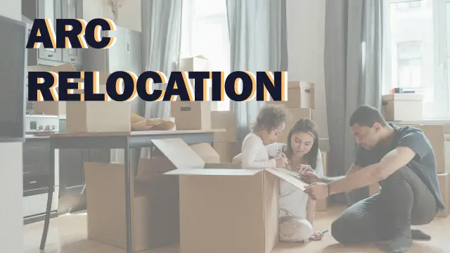 ARC Relocation — a family unpacking cardboard boxes in an empty room