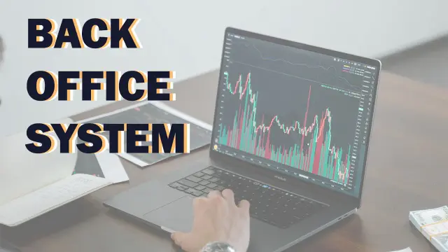 Back Office System — a laptop on a desk showing a candlestick price chart