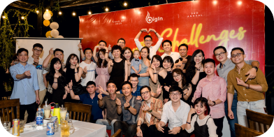 The team at a year-end party in front of a Challenges backdrop